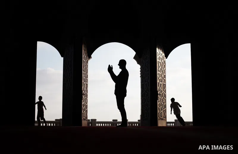 A Palestinian man reads from the Koran in a mosque during the holy month of Ramadan in Gaza City, Gaza Strip, 12 July 2013. Muslims around the world are observing the holy fasting month of Ramadan in which they refrain f...