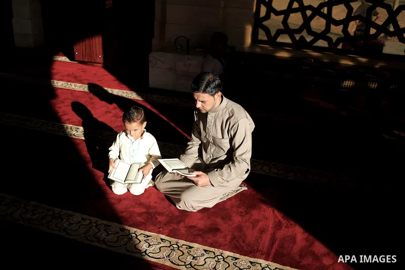 A Palestinian man reads from the Koran in a mosque during the holy month of Ramadan in Gaza City, Gaza Strip, 12 July 2013. Muslims around the world are observing the holy fasting month of Ramadan in which they refrain f...
