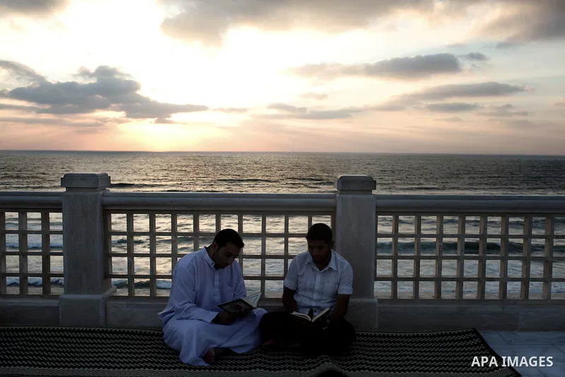 A Palestinian man reads from the Koran in a mosque during the holy month of Ramadan in Gaza City, Gaza Strip, 12 July 2013. Muslims around the world are observing the holy fasting month of Ramadan in which they refrain f...