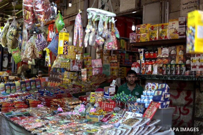 A Palestinian vendor sells goods the fourth day of the Muslim fasting month of Ramadan on July 13, 2013 in Gaza city. During Ramadan, one of the five main religious obligations under Islam, Muslims are required to abstai...