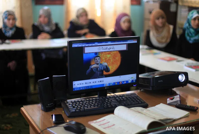 Palestinian deaf girls take part in Quran memorizing camp named 'We are rising by Quran', in Gaza city on July 18, 2013. Photo by Ashraf Amra