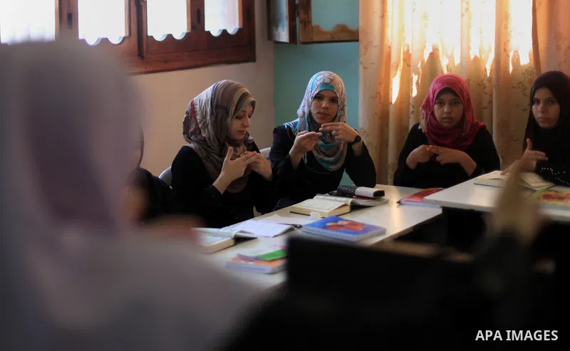 Palestinian deaf girls take part in Quran memorizing camp named 'We are rising by Quran', in Gaza city on July 18, 2013. Photo by Ashraf Amra