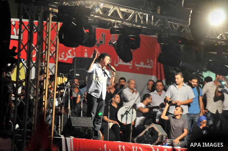 Opponents of ousted President Mohammed Morsi take part in a rally in support Egyptian Defense Minister General Abdul Fatah al-Sisi at Tahrir quare, in Cairo, Egypt, late Friday, July 19, 2013. With the military beefing u...