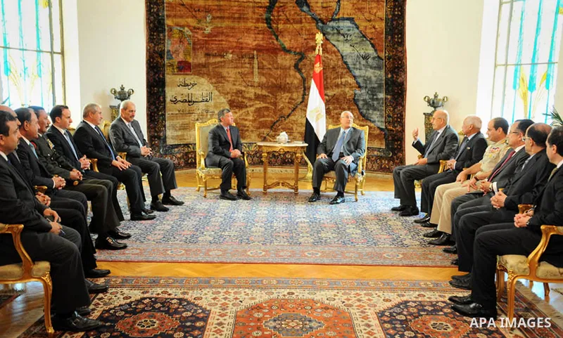 A handout picture released by the Egyptian Presidency shows Egypt's interim president Adly Mansour meeting with Jordan's King Abdullah II on July 20, 2013 in the Egyptian capital Cairo. The Jordanian monarch had been amo...