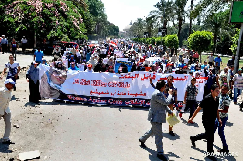Supporters of ousted Egyptian President Mohammed Morsi march through the residential neighborhood of Garden City, passing several diplomatic missions, but avoiding the U.S. embassy, in Cairo, Egypt, Saturday, July 21, 20...