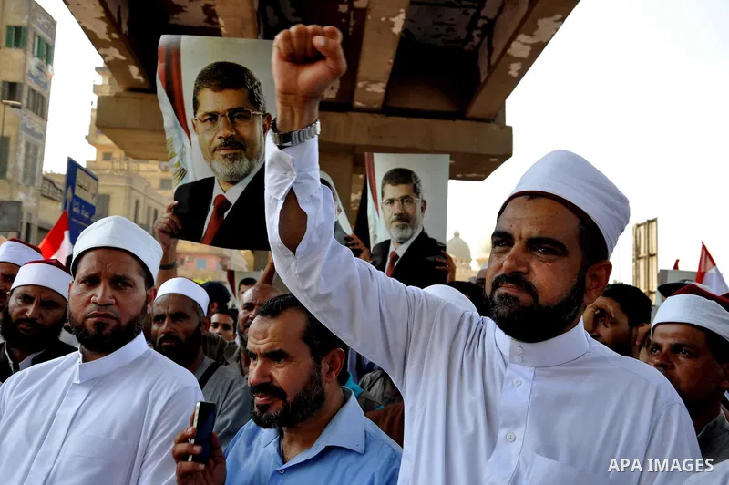 Members of the Muslim Brotherhood and supporters of ousted Egyptian President Mohamed Mursi shout slogans during a demonstration outside al-Noor mosque in Cairo July 22, 2013. The family of ousted Egyptian President Moha...