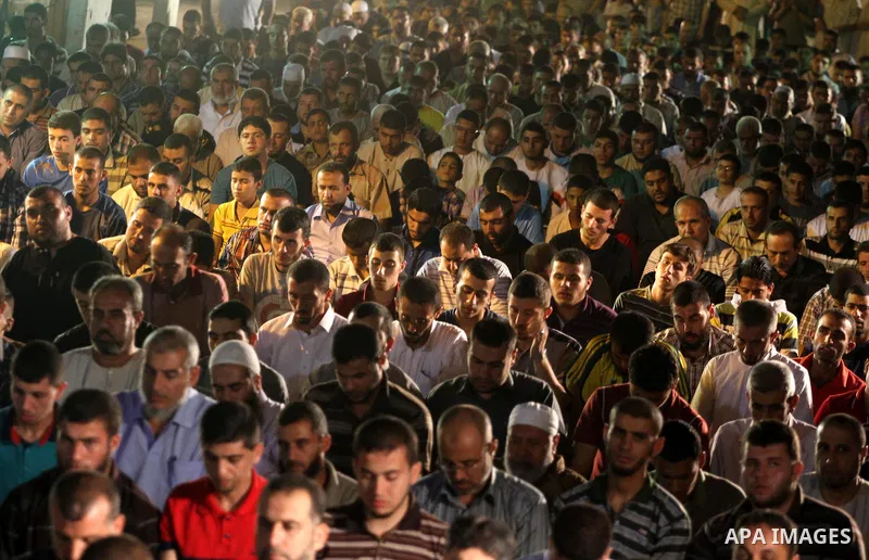 Palestinian Prime Minister in Gaza Ismail Haniyeh leads a night prayer known as "Tarawih" during a rally to show solidarity with Palestinian prisoners inside Israeli jails, in Gaza City July 22, 2013. According to a Pale...