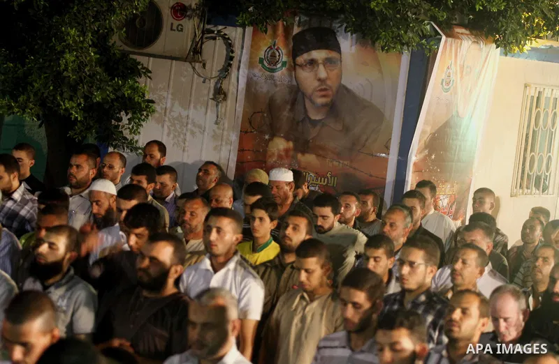 Palestinian Prime Minister in Gaza Ismail Haniyeh leads a night prayer known as "Tarawih" during a rally to show solidarity with Palestinian prisoners inside Israeli jails, in Gaza City July 22, 2013. According to a Pale...