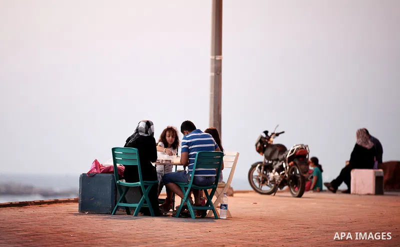 Palestinian Families break their fasting at the beach during the holy fasting month of Ramadan, in Gaza city on July 22, 2013. During Ramadan, muslims around the world are observing the holy fasting month of Ramadan in w...