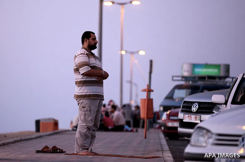 Palestinian Families break their fasting at the beach during the holy fasting month of Ramadan, in Gaza city on July 22, 2013. During Ramadan, muslims around the world are observing the holy fasting month of Ramadan in w...