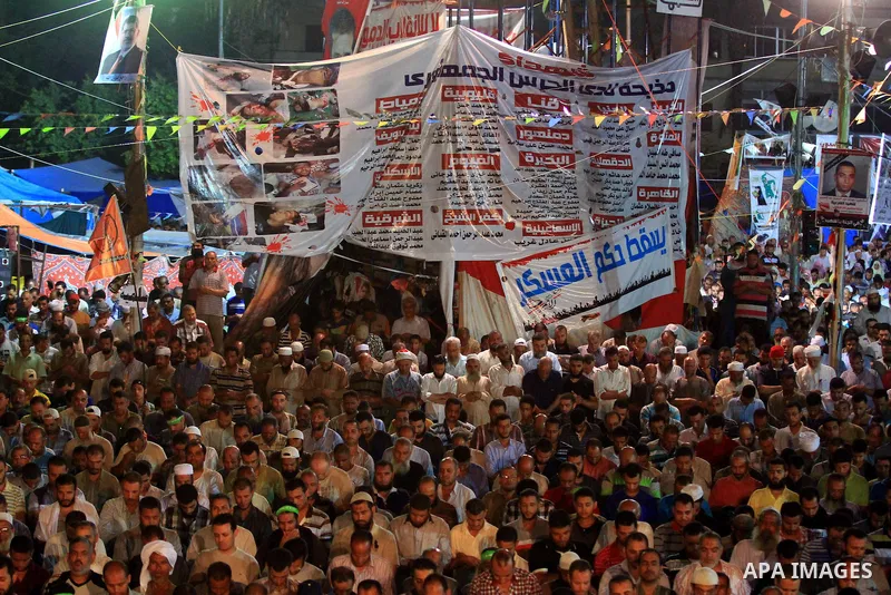 Supporters of the Muslim Brotherhood pray during a protest in support of ousted president Mohamed Morsi, outside Rabaa al-Adawiya mosque in Cairo, Egypt, July 29, 2013. Deadly clashes broke out during funerals of slain s...
