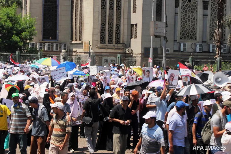 Egyptian supporters of deposed president Mohamed Morsi take part in a demonstration against the government in al-Nasr street in Cairo on July 30, 2013. EU foreign policy chief Catherine Ashton met Egypt's ousted presiden...
