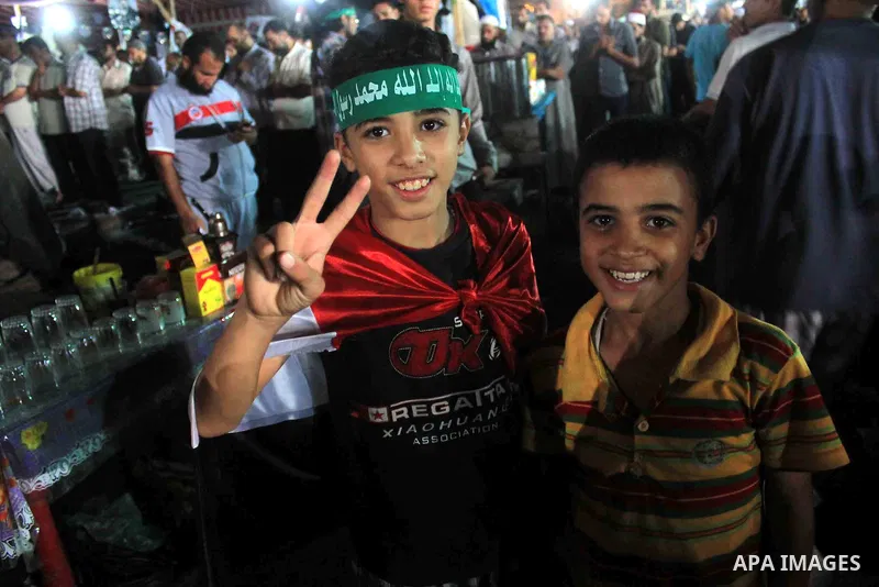 Supporters of Egypt's ousted President Mohammed Morsi chant slogans during a protest outside Rabaa al-Adawiya mosque, where they have installed a camp and hold daily rallies at Nasr City, in Cairo, Egypt, Wednesday, July...