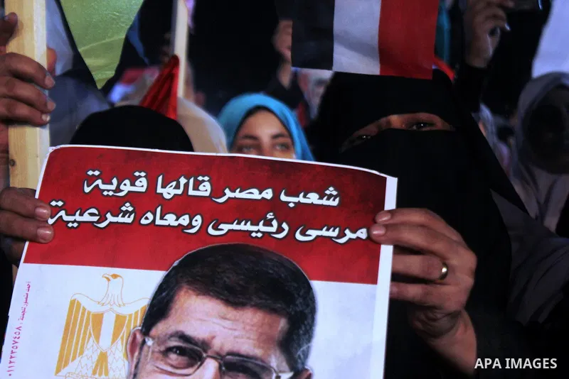 Supporters of Egypt's ousted President Mohammed Morsi chant slogans during a protest outside Rabaa al-Adawiya mosque, where they have installed a camp and hold daily rallies at Nasr City, in Cairo, Egypt, Wednesday, July...
