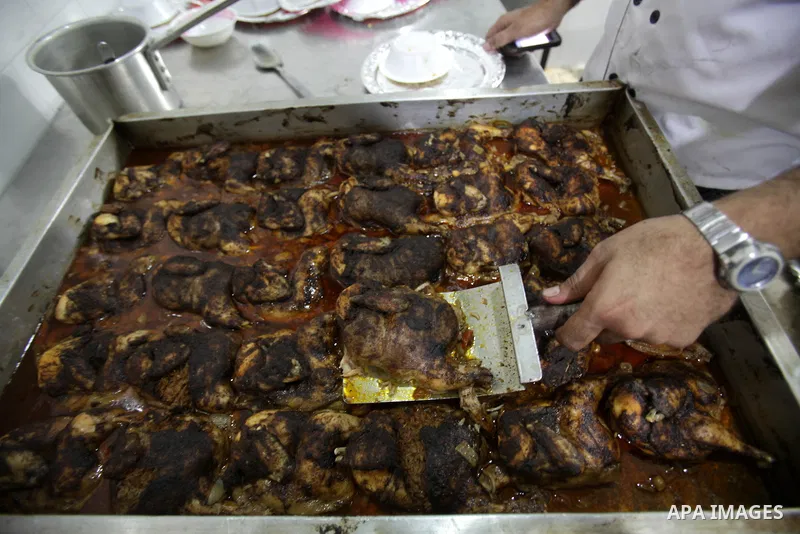 Palestinians prepare rice and meats as they wait for customers several hours before Iftar, the breaking of the day long Ramadan fast in Gaza City, on July 31, 2012. Muslims around the world refrain from eating, drinking...