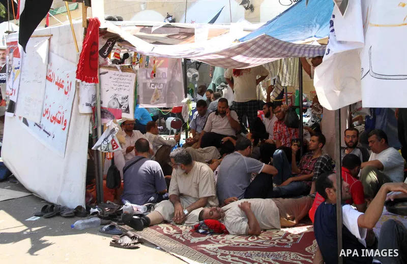 Supporters of the Muslim Brotherhood attend a protest in support of ousted Egyptian President Mohamed Morsi outside the Rabaa al-Adawiya mosque, in in Cairo, Egypt, 01 August 2013. Egyptian police on 01 August called on...