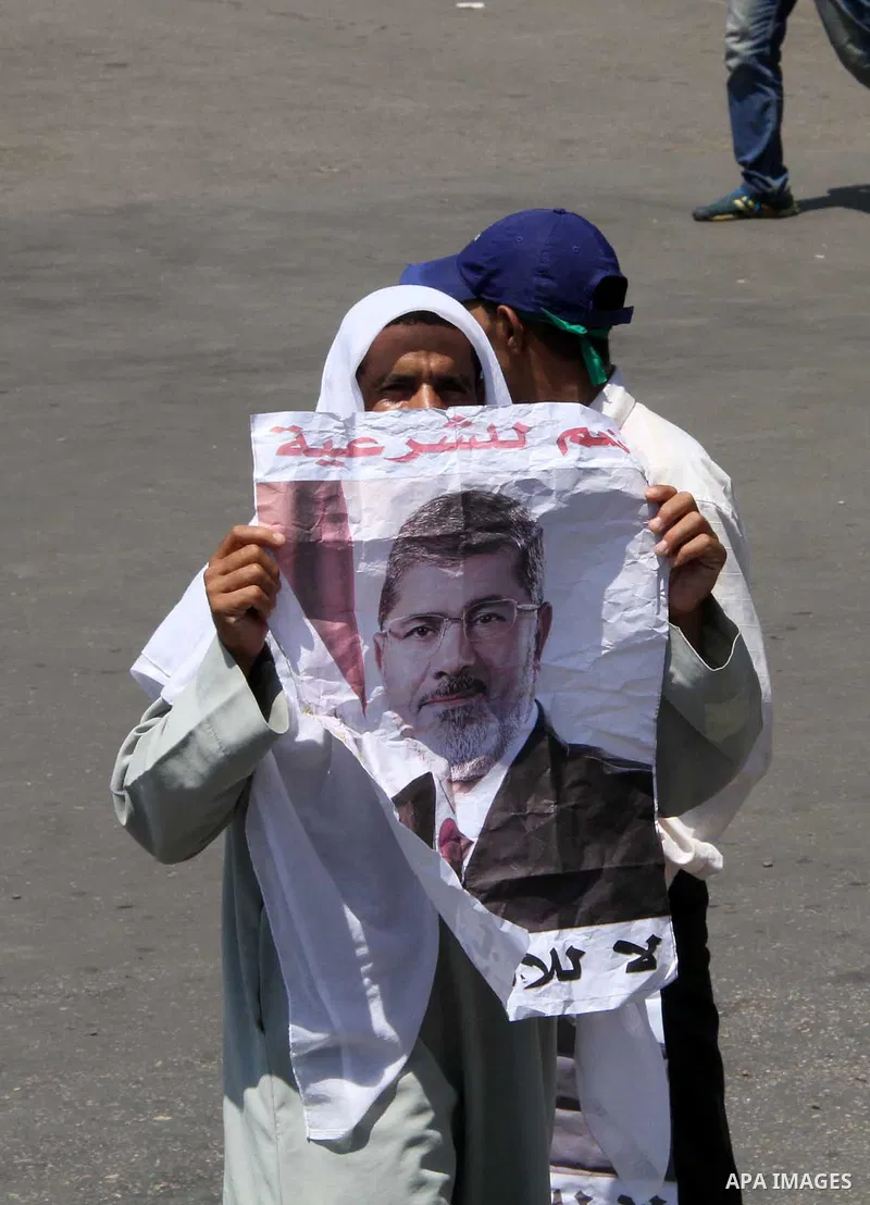 Supporters of the Muslim Brotherhood attend a protest in support of ousted Egyptian President Mohamed Morsi outside the Rabaa al-Adawiya mosque, in in Cairo, Egypt, 01 August 2013. Egyptian police on 01 August called on...