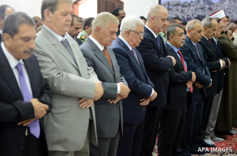 Palestinian President Mahmoud Abbas (Abu Mazen) attends prayer the Eid al-Fitr in the West Bank city of Ramallah, on Aug. 08, 2013. Eid Al-Fitr marks the end of Ramadan, the month of fasting, during which it is customary...