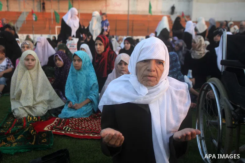 Palestinians attend the early morning Eid Al-Fitr prayer in the Gaza City on August 8, 2013. Muslims around the world are celebrating Eid al-Fitr this week, marking the end of holiest month of Ramadan during which follow...