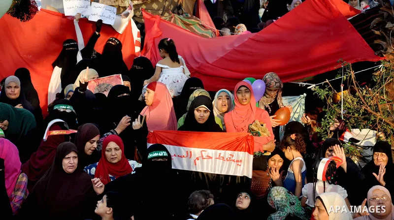 Supporters of ousted Egyptian President Mohamed Morsi during Eid Al-Fitr prayer at Al-Nahda square where thousands of Mohamed Morsi's supporters continued their open-ended sit-in since June 28 in Cairo, Egypt, on Aug. 8,...
