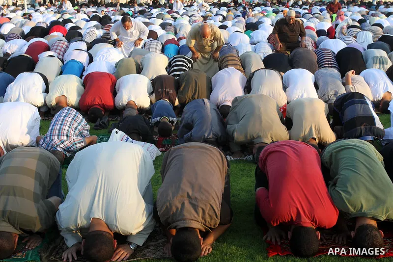 Palestinians attend the early morning Eid Al-Fitr prayer in the Gaza City on August 8, 2013. Muslims around the world are celebrating Eid al-Fitr this week, marking the end of holiest month of Ramadan during which follow...