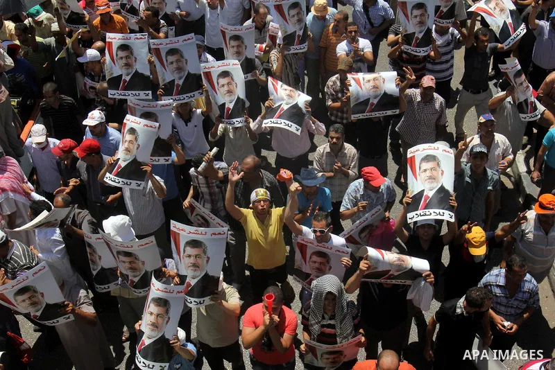 Supporters of ousted Egyptian President Mohammed Morsi take part in a demonstration in support of Morsi in Cairo, on August 9, 2013. Islamist supporters of deposed Egyptian president Mohamed Morsi planned new rallies as...