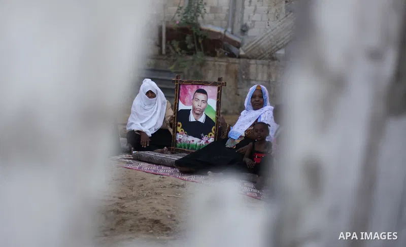 Relatives of Palestinian Ayman Abu Setta, who has been held by Israel for 19 years, celebrate after hearing news on the expected his release in the the village of Zawayda, central Gaza Strip, August 12, 2013. Israel on M...