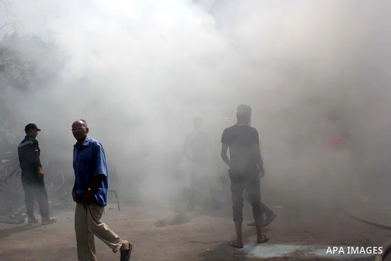 Egyptians try to put out a fire in a government building that was set ablaze in Giza's district of Cairo, August 15, 2013. Hundreds of supporters of Egypt's Muslim Brotherhood stormed a government building in Cairo on Th...