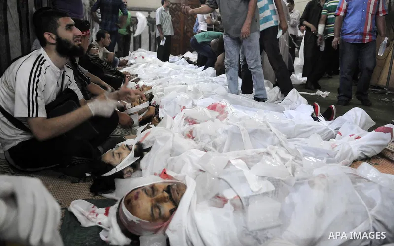 Bodies of protesters who support ousted Egyptian President Mohamed Mursi, killed during clashes with Egyptian security forces, lie inside a mosque in Ramses Square, in downtown Cairo, Egypt, Friday, Aug. 16, 2013. Heavy...