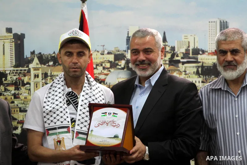 Palestinian Prime Minister in Gaza strip, Ismail Haniyeh, honors the prisoners released, in Gaza city on Aug. 19, 2013. Israel released 26 long-held Palestinian prisoners in a planned goodwill gesture hours ahead of a sc...