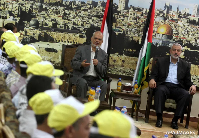 Palestinian Prime Minister in Gaza strip, Ismail Haniyeh, honors the prisoners released, in Gaza city on Aug. 19, 2013. Israel released 26 long-held Palestinian prisoners in a planned goodwill gesture hours ahead of a sc...