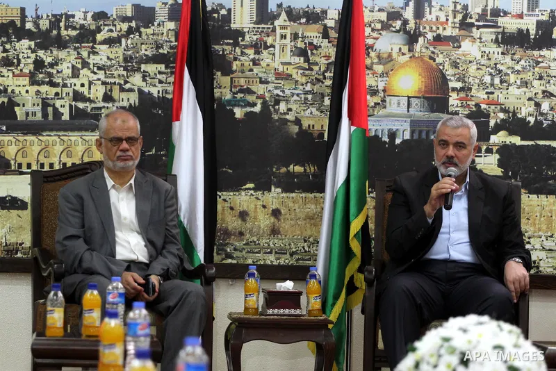 Palestinian Prime Minister in Gaza strip, Ismail Haniyeh, honors the prisoners released, in Gaza city on Aug. 19, 2013. Israel released 26 long-held Palestinian prisoners in a planned goodwill gesture hours ahead of a sc...