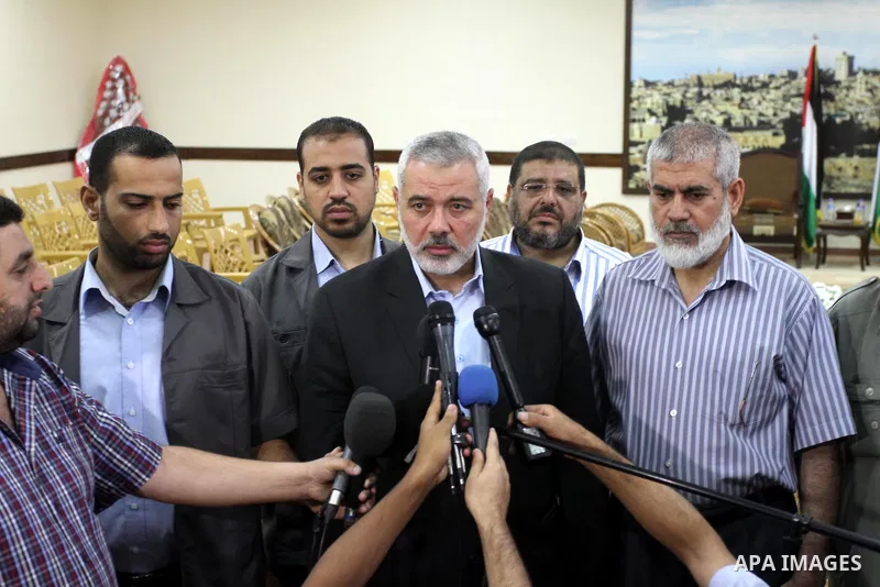 Palestinian Prime Minister in Gaza strip, Ismail Haniyeh, honors the prisoners released, in Gaza city on Aug. 19, 2013. Israel released 26 long-held Palestinian prisoners in a planned goodwill gesture hours ahead of a sc...