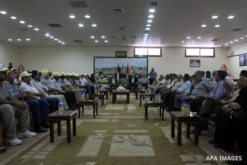 Palestinian Prime Minister in Gaza strip, Ismail Haniyeh, honors the prisoners released, in Gaza city on Aug. 19, 2013. Israel released 26 long-held Palestinian prisoners in a planned goodwill gesture hours ahead of a sc...