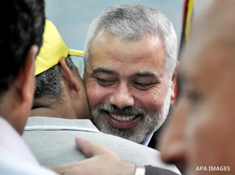Palestinian Prime Minister in Gaza strip, Ismail Haniyeh, honors the prisoners released, in Gaza city on Aug. 19, 2013. Israel released 26 long-held Palestinian prisoners in a planned goodwill gesture hours ahead of a sc...