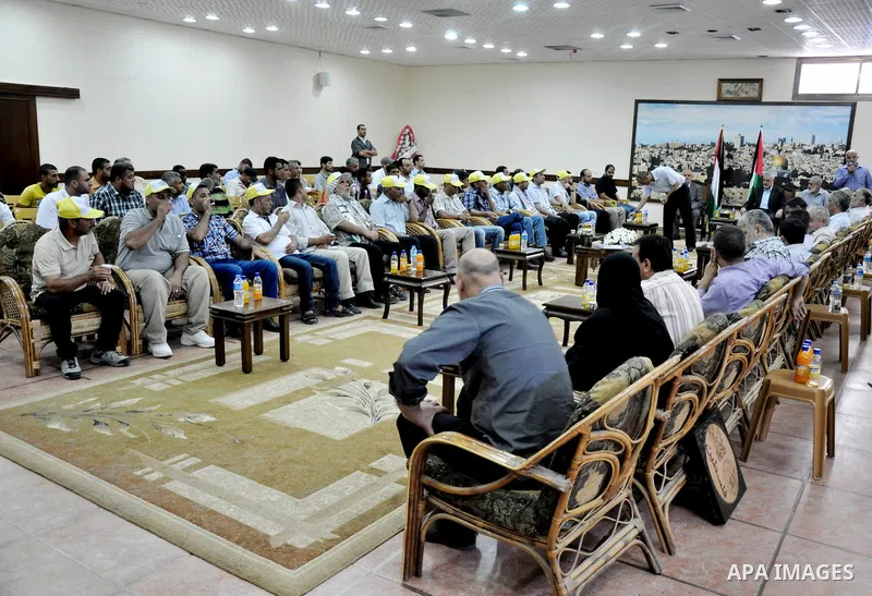 Palestinian Prime Minister in Gaza strip, Ismail Haniyeh, honors the prisoners released, in Gaza city on Aug. 19, 2013. Israel released 26 long-held Palestinian prisoners in a planned goodwill gesture hours ahead of a sc...