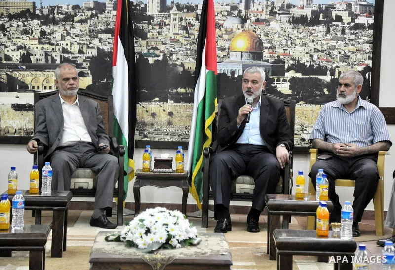 Palestinian Prime Minister in Gaza strip, Ismail Haniyeh, honors the prisoners released, in Gaza city on Aug. 19, 2013. Israel released 26 long-held Palestinian prisoners in a planned goodwill gesture hours ahead of a sc...
