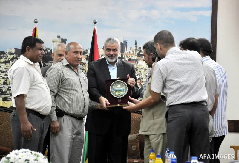 Palestinian Prime Minister in Gaza strip, Ismail Haniyeh, honors the prisoners released, in Gaza city on Aug. 19, 2013. Israel released 26 long-held Palestinian prisoners in a planned goodwill gesture hours ahead of a sc...
