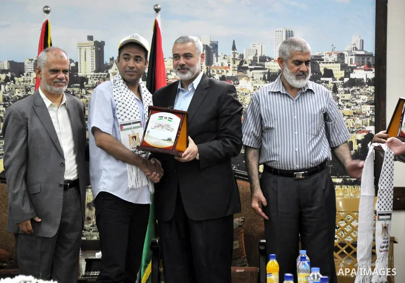 Palestinian Prime Minister in Gaza strip, Ismail Haniyeh, honors the prisoners released, in Gaza city on Aug. 19, 2013. Israel released 26 long-held Palestinian prisoners in a planned goodwill gesture hours ahead of a sc...