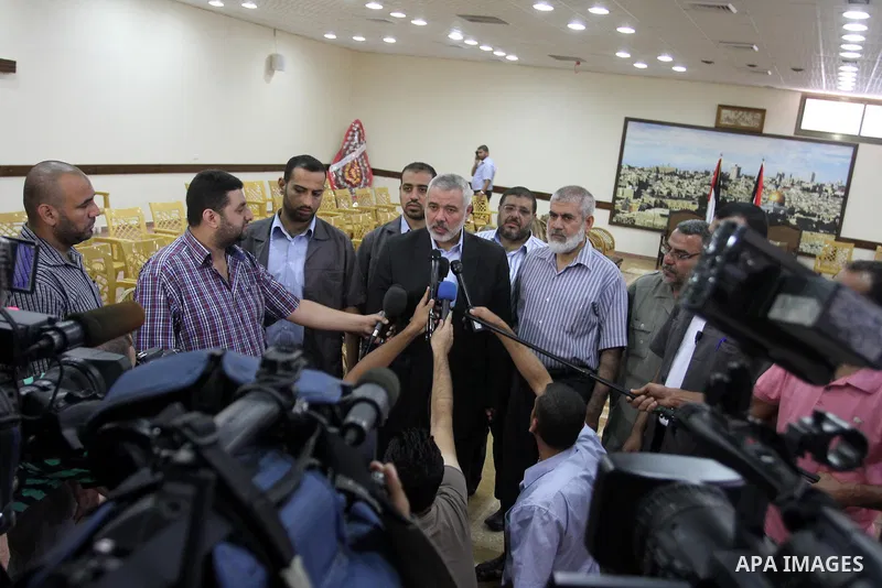 Palestinian Prime Minister in Gaza strip, Ismail Haniyeh, honors the prisoners released, in Gaza city on Aug. 19, 2013. Israel released 26 long-held Palestinian prisoners in a planned goodwill gesture hours ahead of a sc...