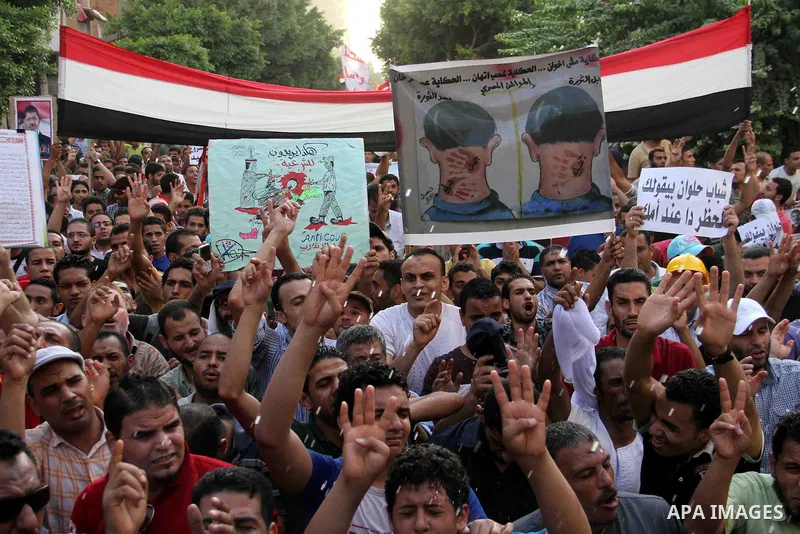 Supporters of Egypt's ousted President Mohammed Morsi, shout slogans during a protest in the Helwan district southern Cairo, Egypt, Monday, Aug. 19, 2013. Tensions in Egypt have soared since the army ousted Morsi, Hosni...