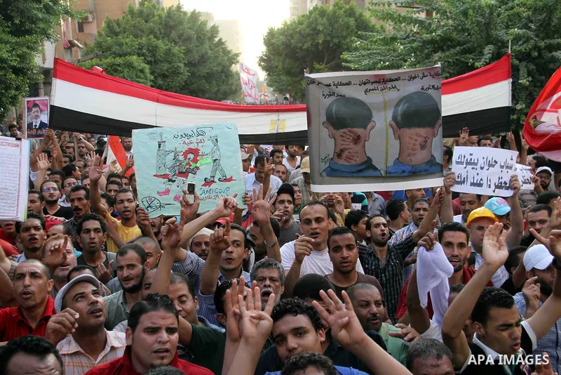 Supporters of Egypt's ousted President Mohammed Morsi, shout slogans during a protest in the Helwan district southern Cairo, Egypt, Monday, Aug. 19, 2013. Tensions in Egypt have soared since the army ousted Morsi, Hosni...