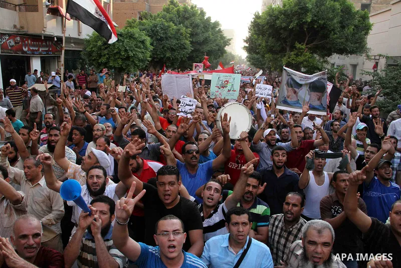 Supporters of Egypt's ousted President Mohammed Morsi, shout slogans during a protest in the Helwan district southern Cairo, Egypt, Monday, Aug. 19, 2013. Tensions in Egypt have soared since the army ousted Morsi, Hosni...