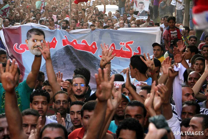 Supporters of Egypt's ousted President Mohammed Morsi, shout slogans during a protest in the Helwan district southern Cairo, Egypt, Monday, Aug. 19, 2013. Tensions in Egypt have soared since the army ousted Morsi, Hosni...