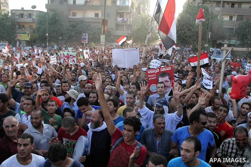 Supporters of Egypt's ousted President Mohammed Morsi, shout slogans during a protest in the Helwan district southern Cairo, Egypt, Monday, Aug. 19, 2013. Tensions in Egypt have soared since the army ousted Morsi, Hosni...