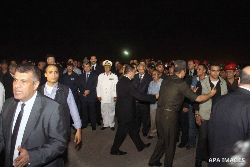 Egyptians gather around the coffins with the Egyptian Sinai policemen who were killed in Arish, during their funeral at Almaza military airport, Egypt, 19 August 2013. Egyptian security forces sealed off the Sinai Penins...