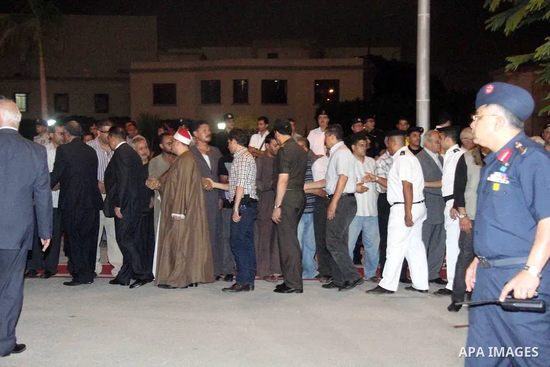 Egyptians gather around the coffins with the Egyptian Sinai policemen who were killed in Arish, during their funeral at Almaza military airport, Egypt, 19 August 2013. Egyptian security forces sealed off the Sinai Penins...