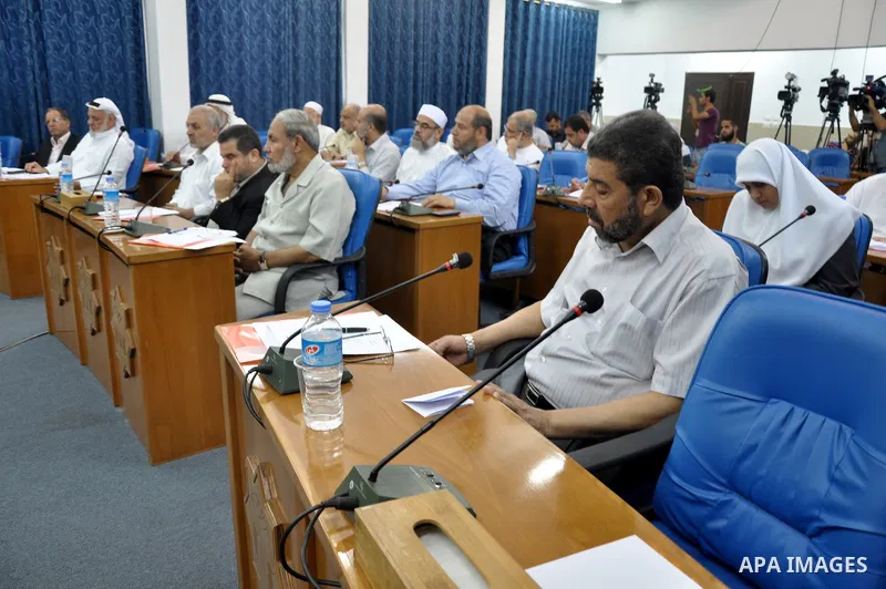 Palestinian members of the Legislative Council attend a meeting to discus the political situation in Egypt, in Gaza City on Aug. 20, 2013. Photo by Mohammed Talatene