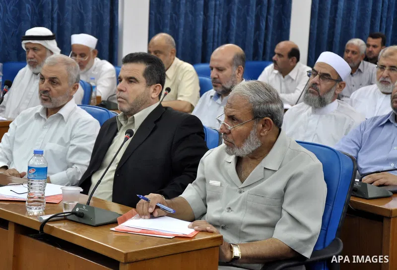 Palestinian members of the Legislative Council attend a meeting to discus the political situation in Egypt, in Gaza City on Aug. 20, 2013. Photo by Mohammed Talatene
