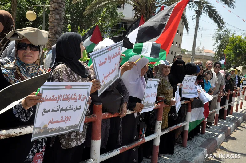 Palestinian women gather for a demonstration calling for the end of the political division between the Gaza Strip Hamas-led leadership and the Palestinian Authority Fatah-led in the West Bank city of Ramallah, on Aug. 20...